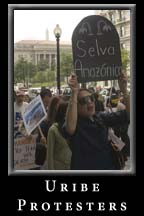 Demonstrators March  in protest of Colombian President Uribe's Luncheon at the National Press Club.